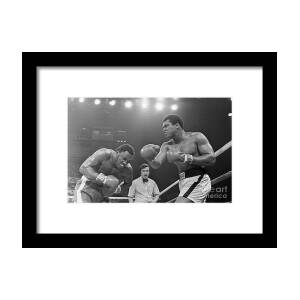 Muhammad Ali Punching Joe Frazier Framed Print by Bettmann Muhammad Ali Punching Joe Frazier Framed Print by Bettmann